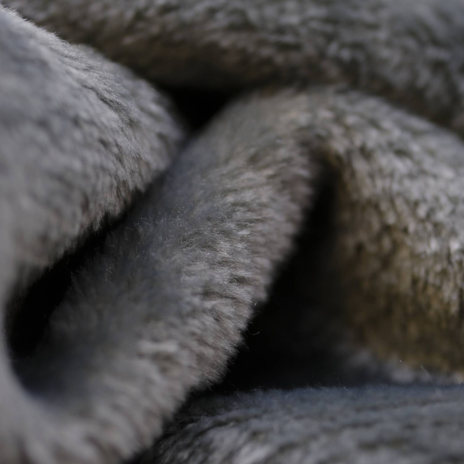 Up Close pIcture of the Grey microfibre face cloth 